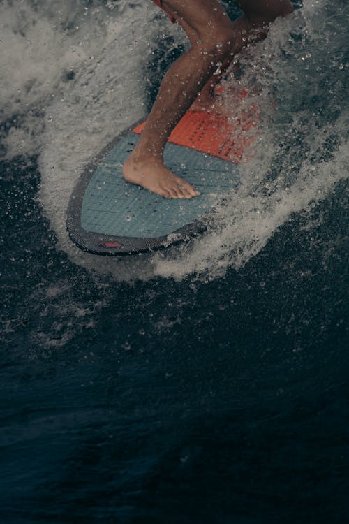 A Surfer Riding a Surfboard