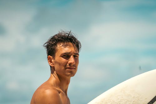 Close-Up Photo of Topless Man Looking Pensive