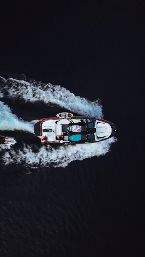 Motorboat Sailing Through Dark Water