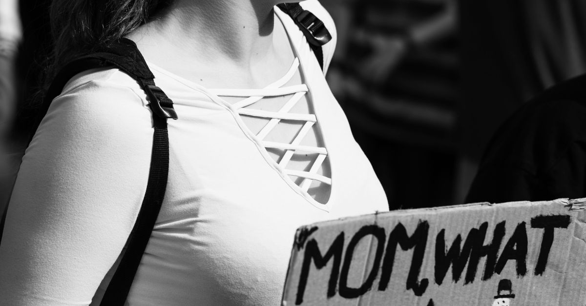 Carrying Sign Grayscale Photo of Woman Carrying Sign · Free Stock Photo