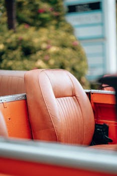 Close-up of a vintage car seat with outdoor background in Dar es Salaam.