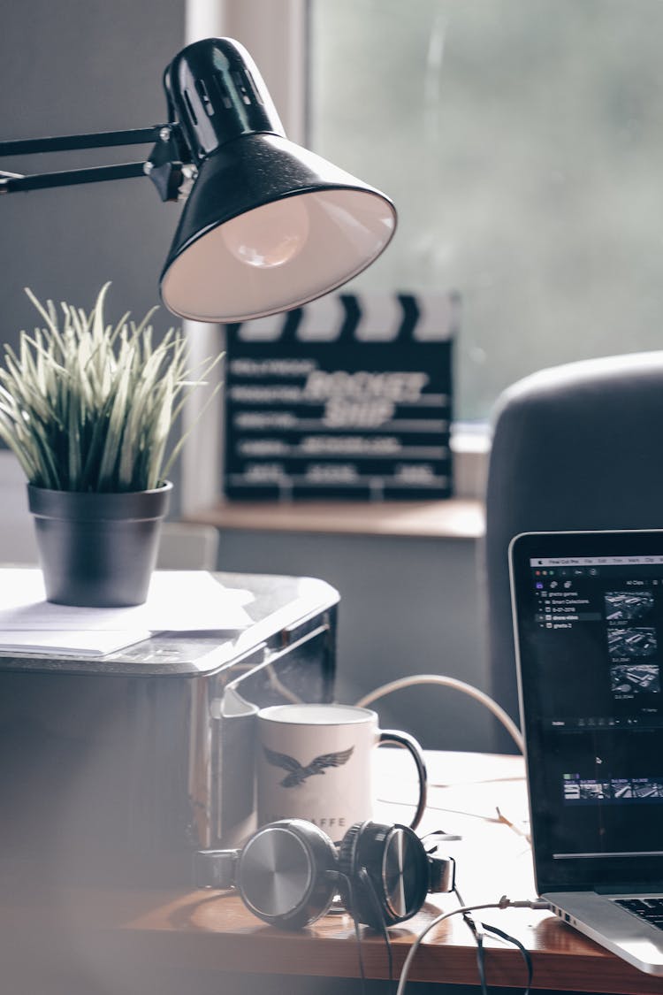 Lamp And Headphones On Table