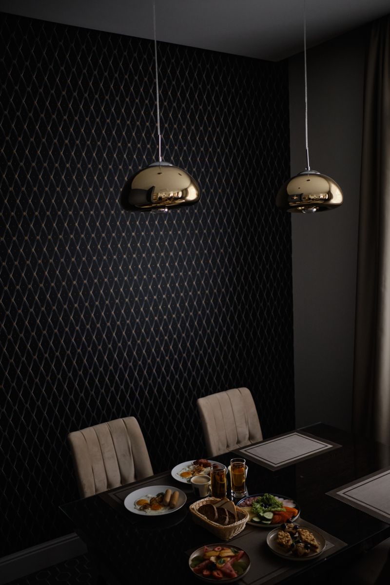 Brass dining room with pendant lighting