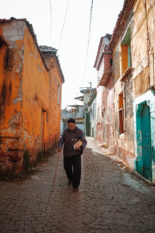A Man Using Cane While Walking