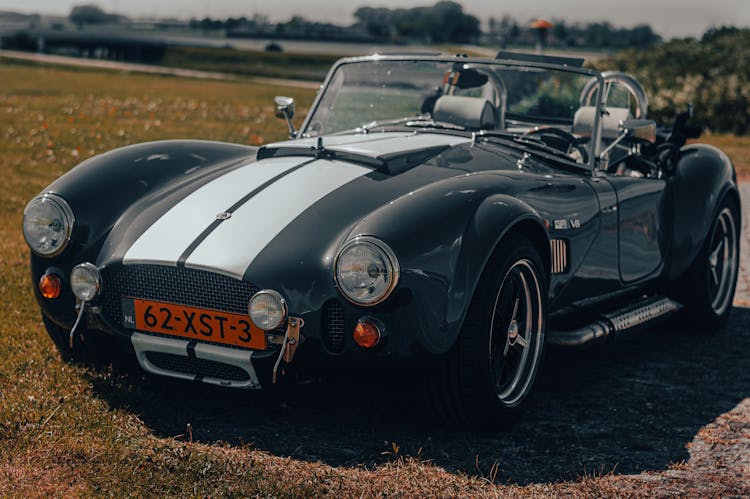 An AC Shelby Cobra On A Field