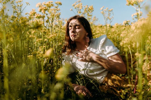 A Woman Lying Down on a Glower Field