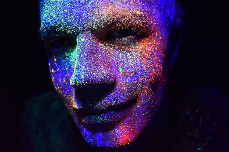 Man With Colourful Fluorescent Paint On His Face 