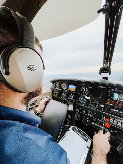 Pilot in Cockpit Flying Plane