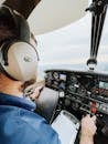 Pilot in Cockpit Flying Plane