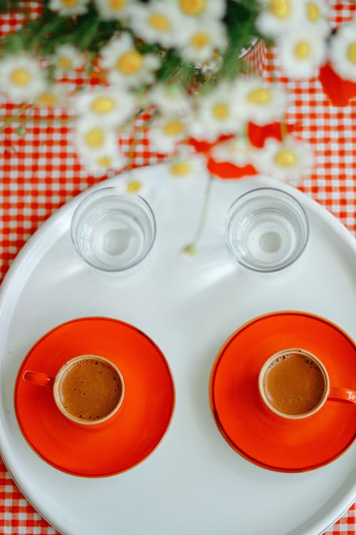 Cups of Coffee and Glasses on White Tray