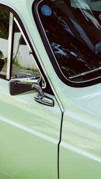 Close-up shot of a vintage green car with shiny chrome details in Istanbul.