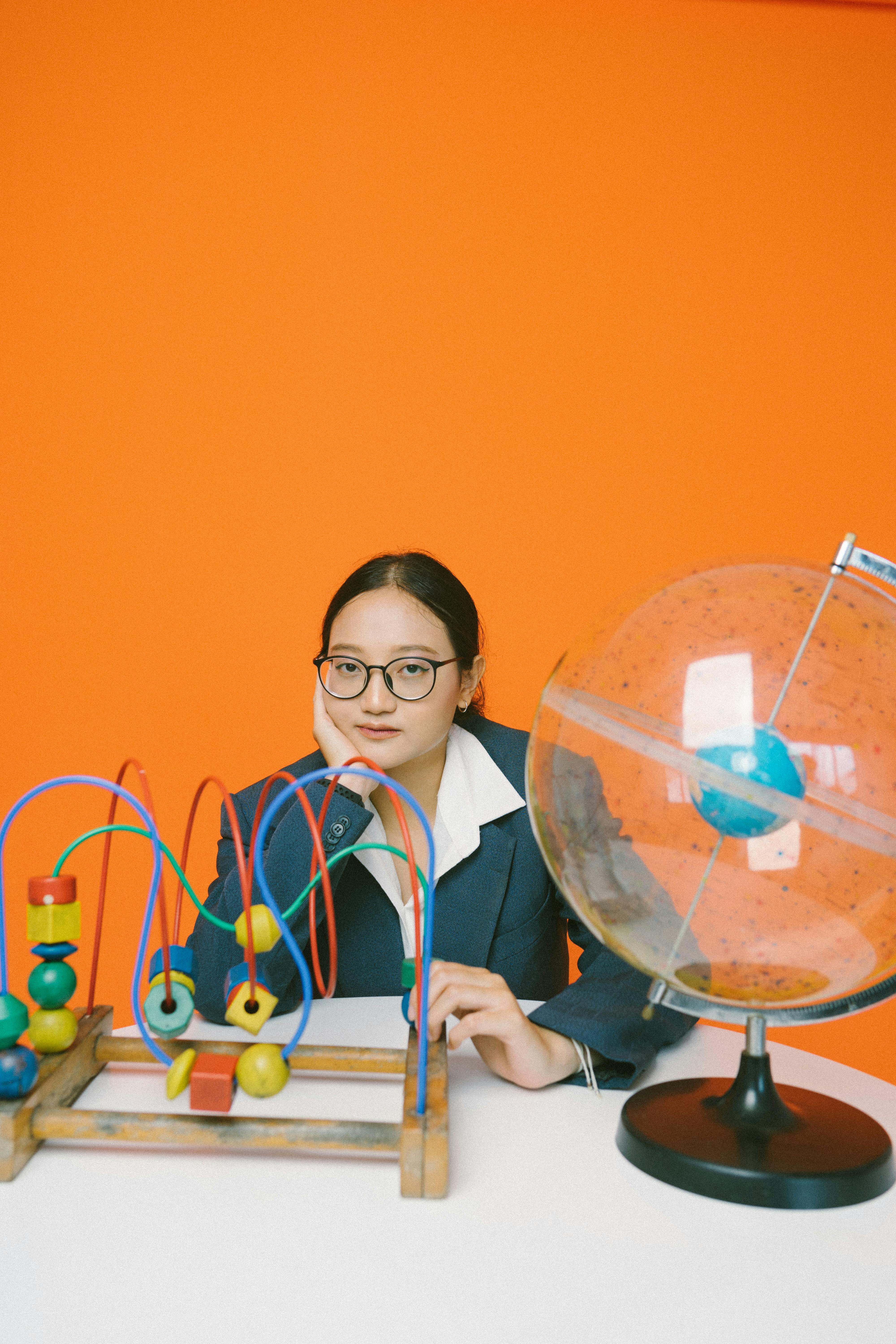 photo of a woman sitting with educational toys