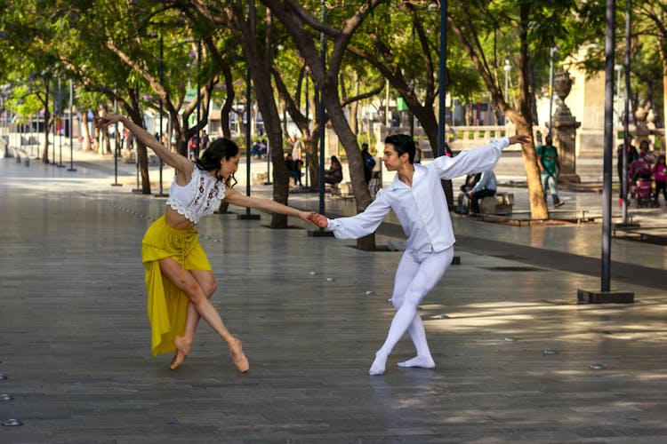 Man And Woman Dancing On The Street