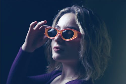 Woman Wearing Sunglasses in Close Up Photography