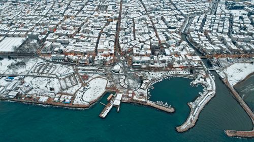 Free Explore the snow-covered urban landscape of Yalova, Turkey, captured from above. Stock Photo