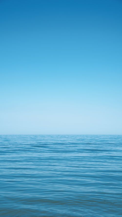 Free Serene view of a blue ocean under a clear summer sky in Türkiye, perfect for relaxation imagery. Stock Photo
