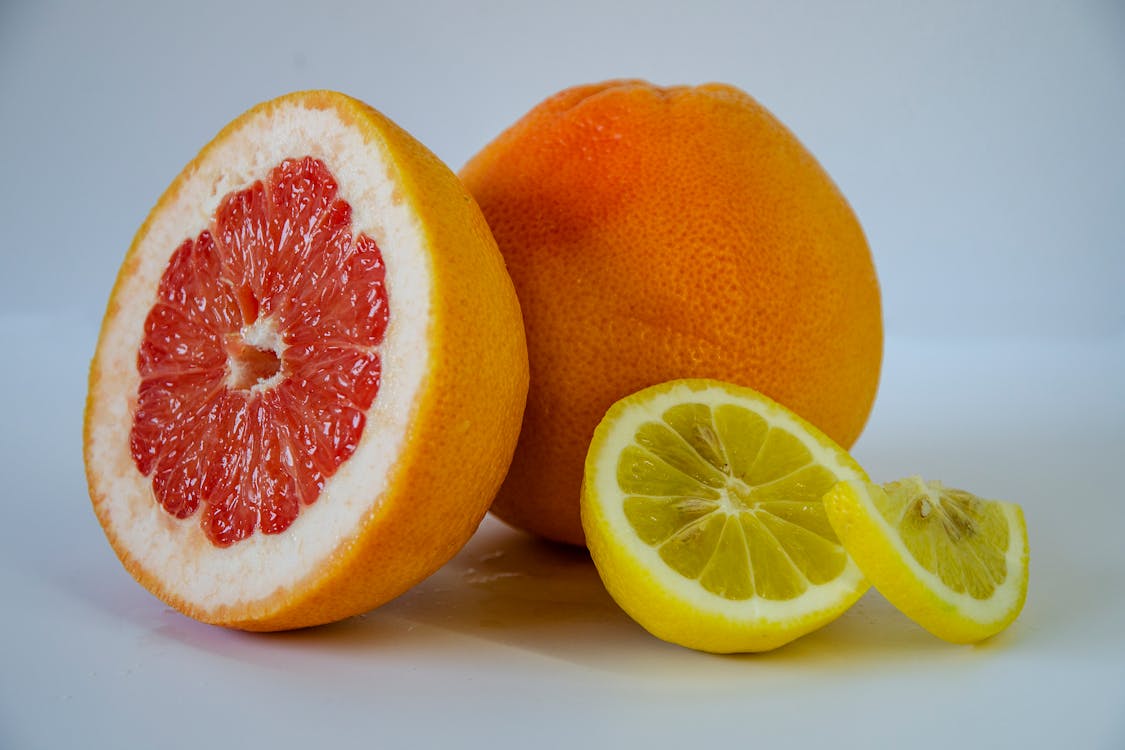 Free Sliced Citrus Fruits in Close Up Photography Stock Photo