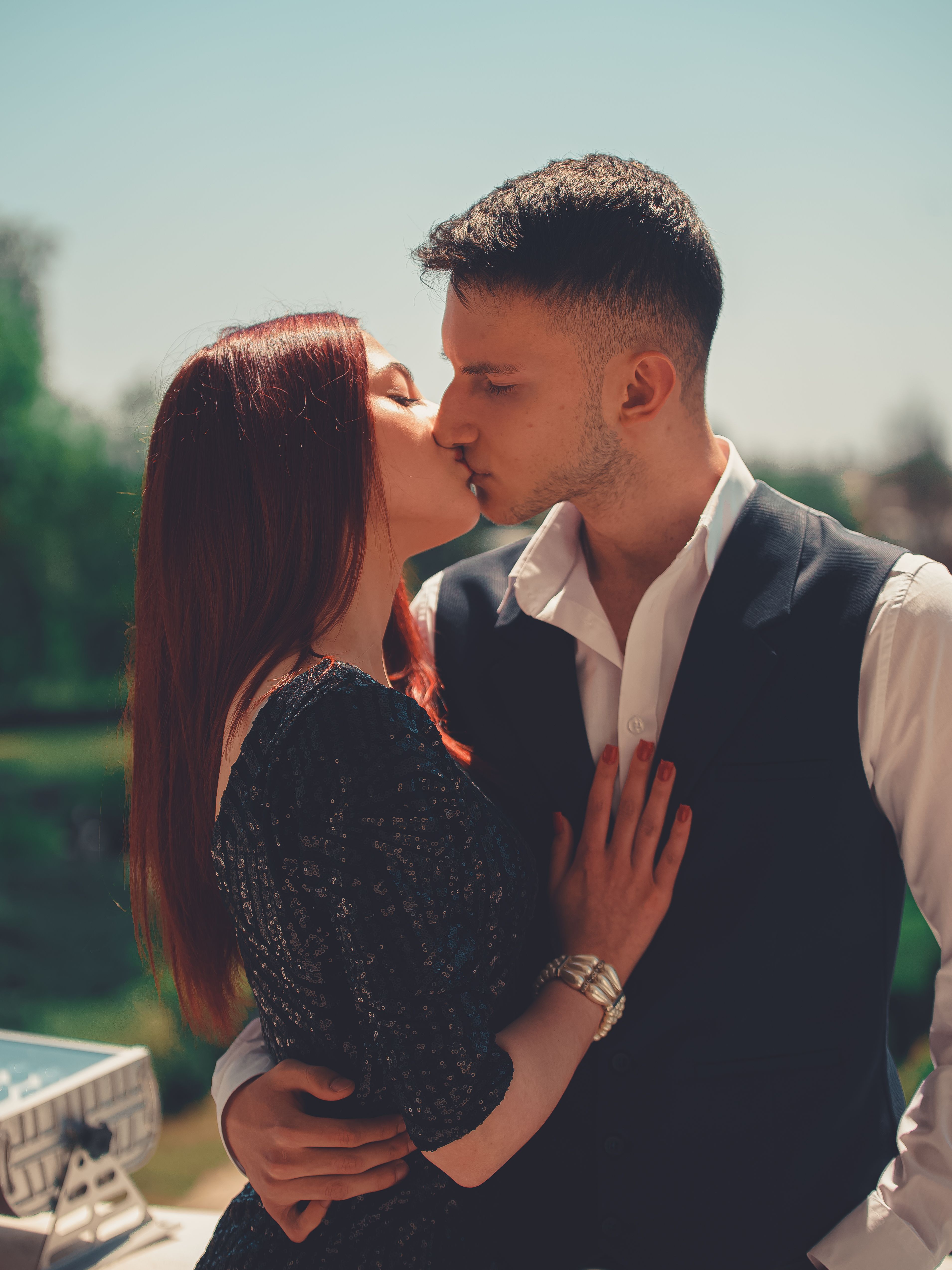 Woman in Leather Jacket Kissing a Man · Free Stock Photo