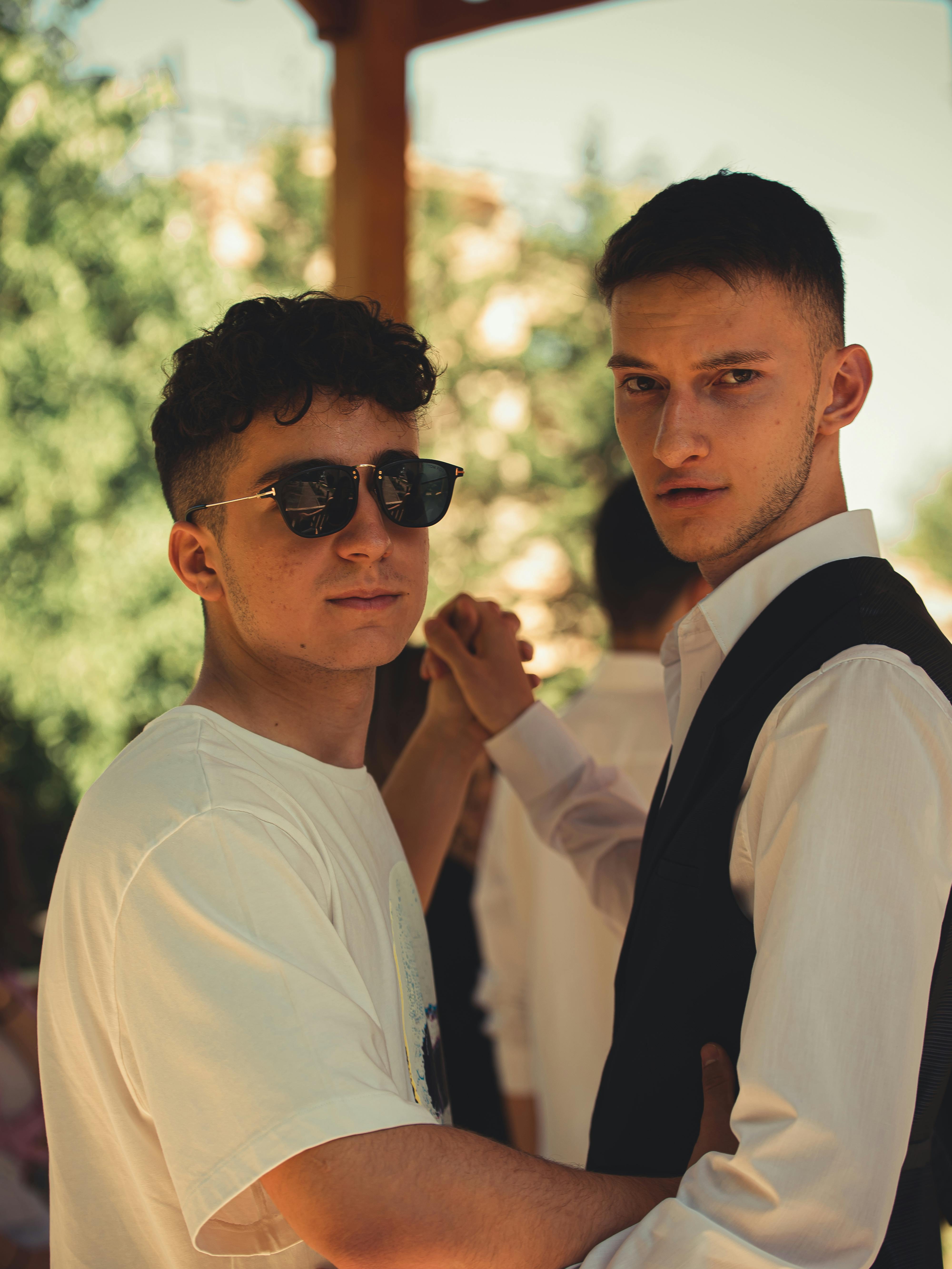 Man Wearing Sunglasses Dancing with Another Man · Free Stock Photo