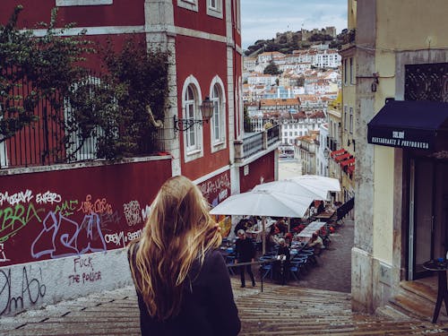 Woman in Black Cardigan Standing Near Concrete Stais