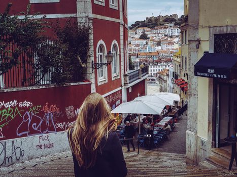 lisbon alfama woman walking