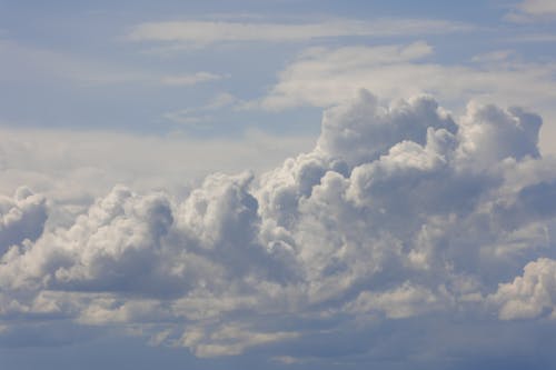 Free White Cumulus Clouds in a Blue Sky Stock Photo