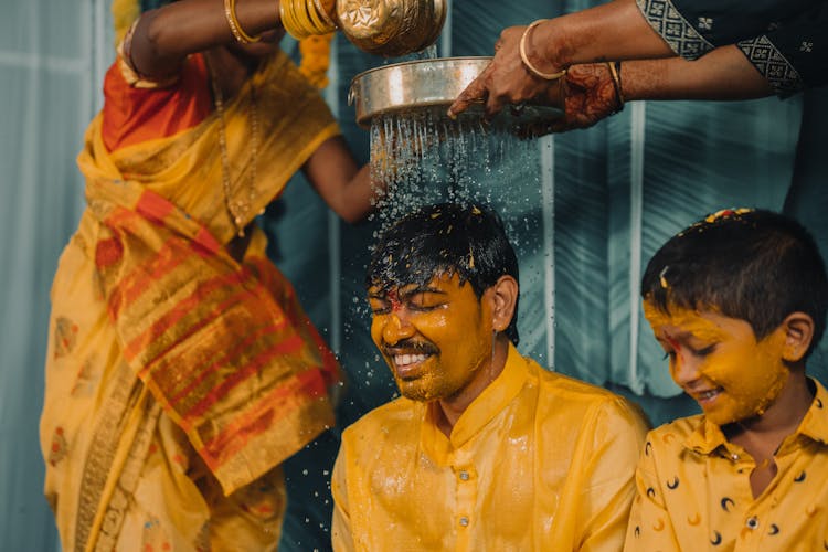 Pouring Water Over Mans Head