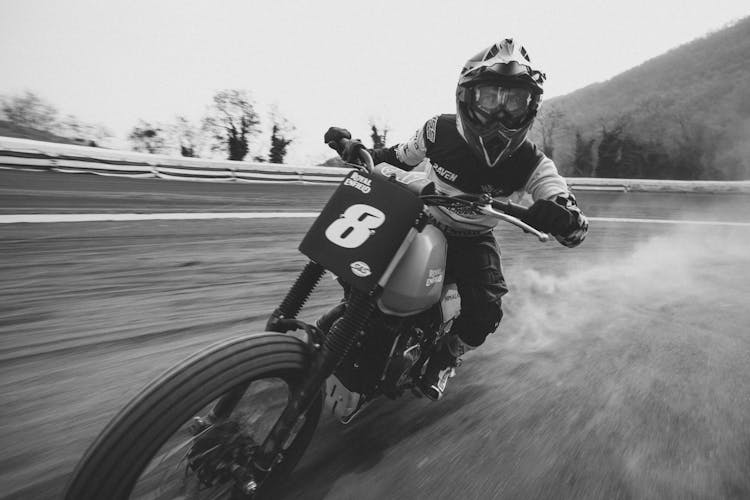 Dynamic Photo Of Speedway Rider In Race