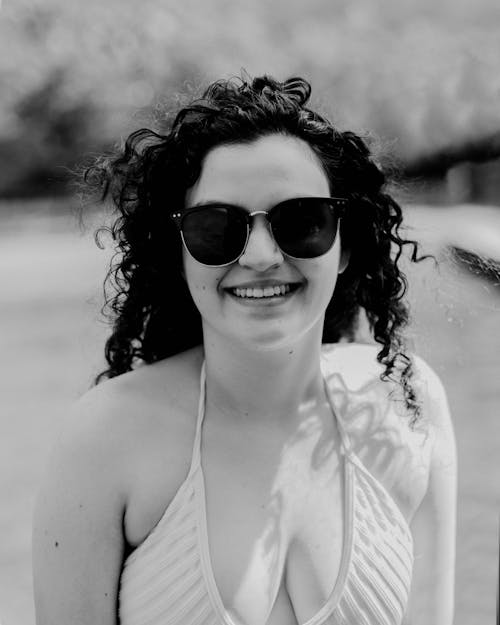 Black and White Photo of Woman Wearing Sunglasses