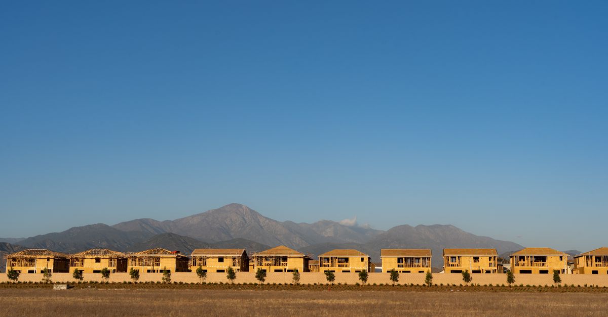 A row of unfinished houses with mountains in the background, Redlands, CA.