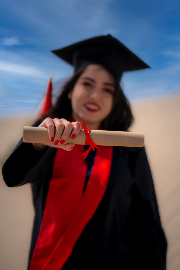 Student Holding A Diploma