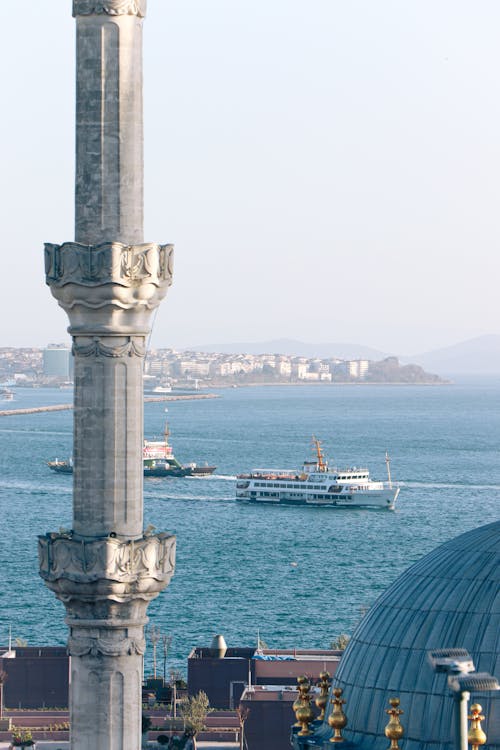 Sailing Ferry on Coast behind Minaret