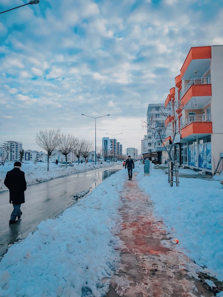 People Walking In City In Winter