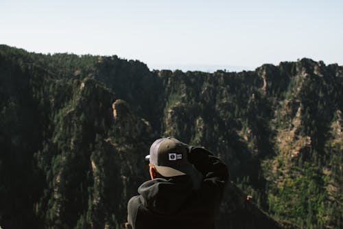 Backview of Man on a Cliffside 