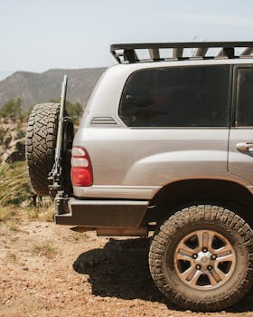 A Toyota SUV parked on a rugged dirt road in Arizona, showcasing off-road capabilities.