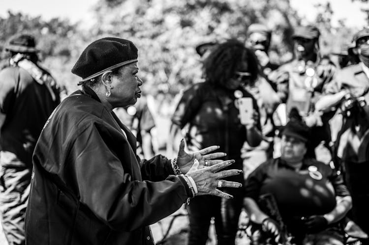 Black And White Picture Of Woman Giving A Speech A A Protest