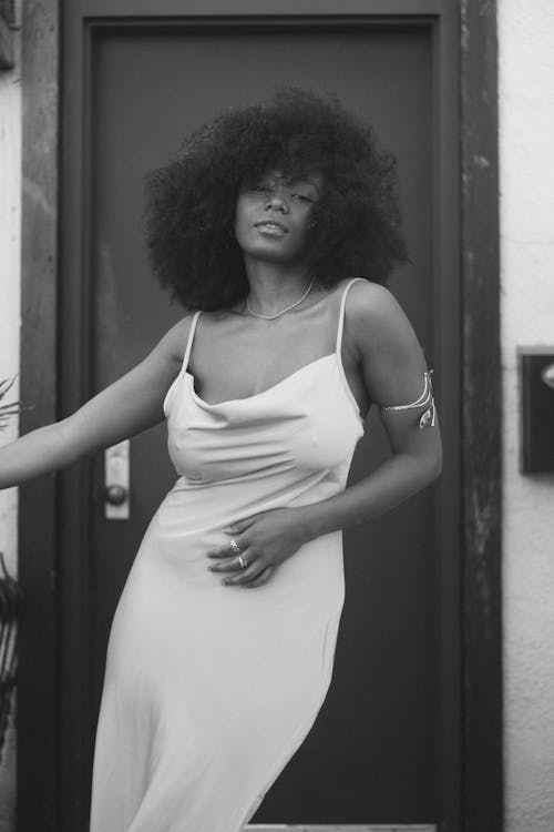 Woman with Afro Hair Wearing White Spaghetti Strap Dress