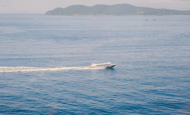 Aerial Photo Of White Motor Boat On Ocean