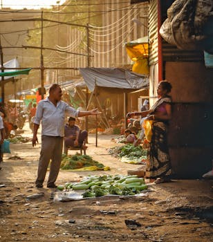 Lively market in Nagpur with people engaging, fresh vegetables, and street vendors.
