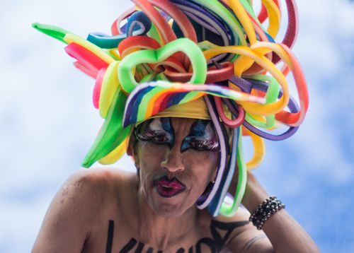Free Colorful expression of pride and identity in Mexico City's parade, featuring unique costume and makeup. Stock Photo