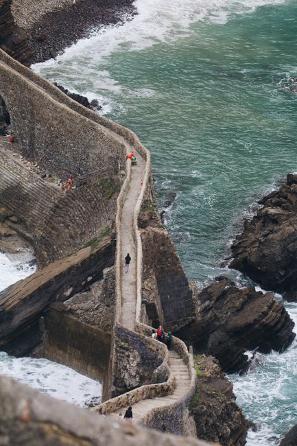 Captivating stone pathway leading to the sea at Gaztelugatxeko Doniene, Spain.