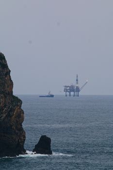 Brown Rock Formation on Sea