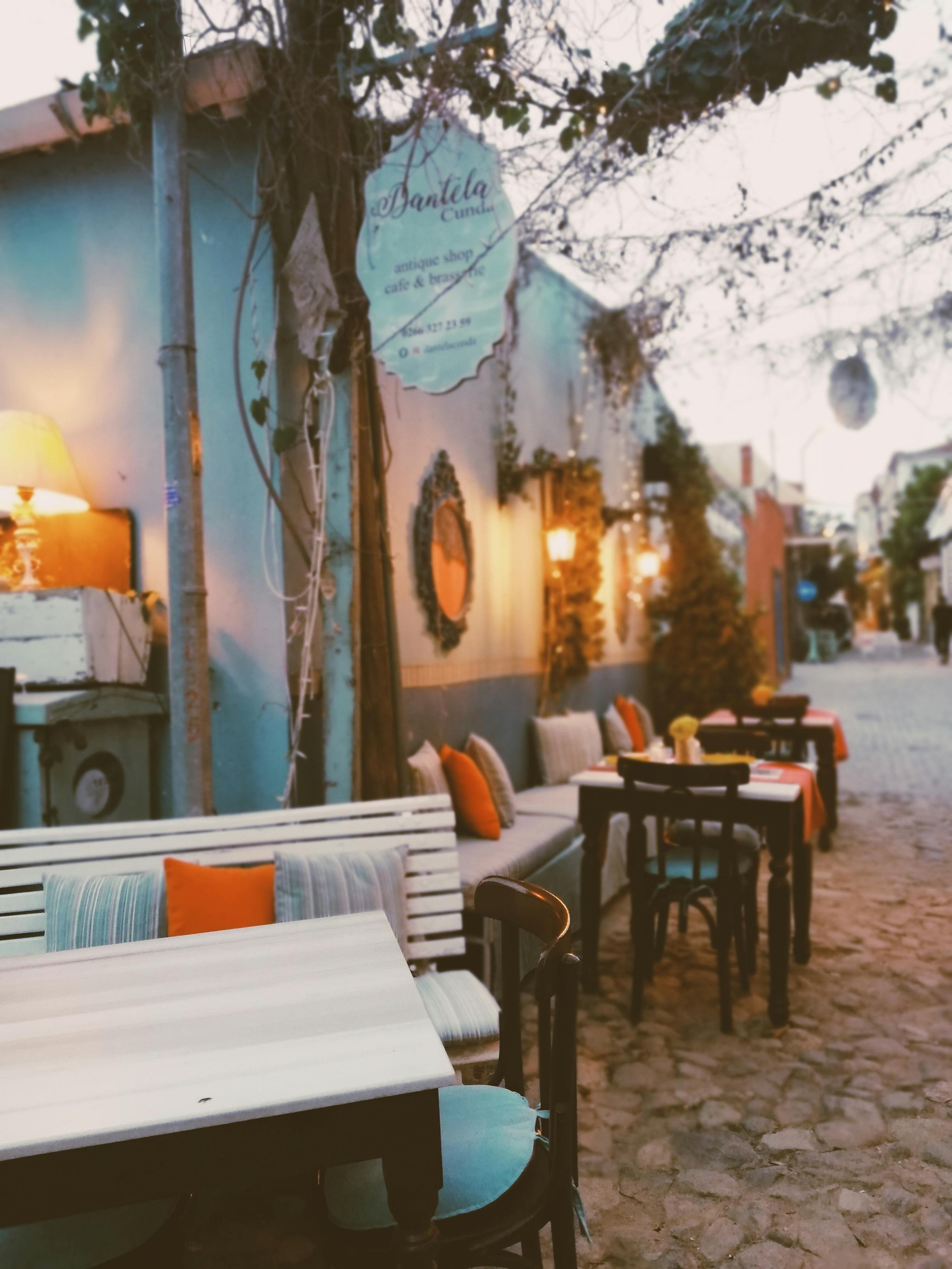 Cafe Tables and Chairs by Building Wall