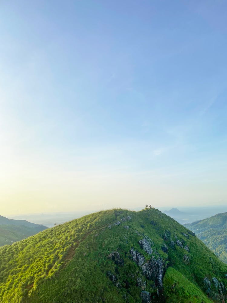 Green Mountain Top Under Blue Sky