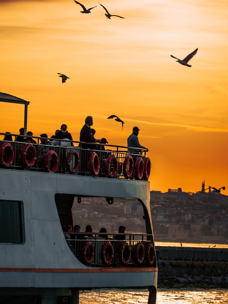 People On Ship At Dawn