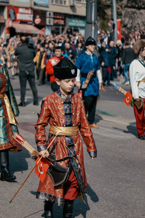 Boy in Traditional Costume on City Parade