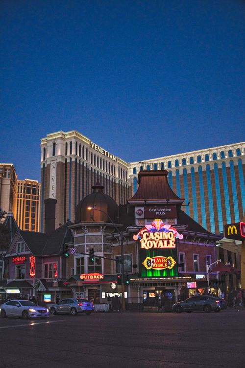 Free Vibrant Las Vegas strip featuring iconic Casino Royale signage against a dusk sky. Stock Photo