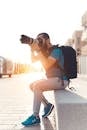 Man Carrying Backpack Taking Photo Using Dslr Camera