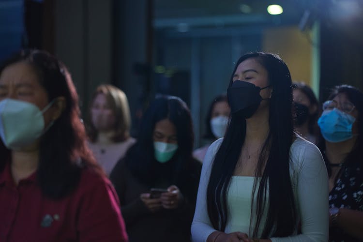 Women Praying Solemnly 