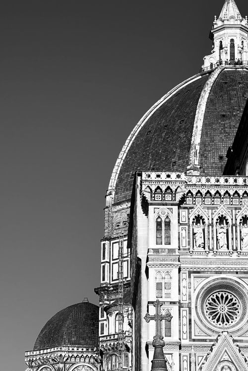 Free Striking black and white photo of Florence Cathedral's intricate facade and dome under a clear sky. Stock Photo